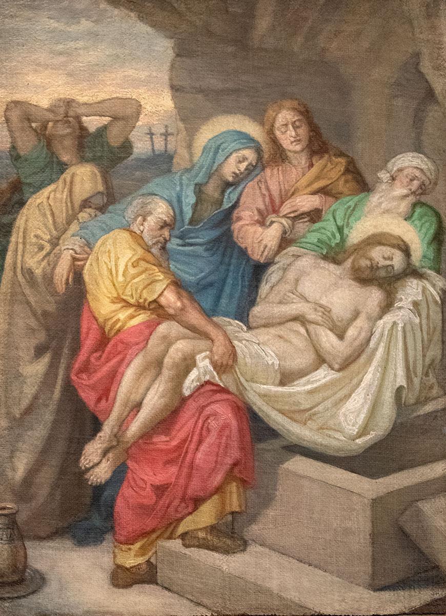 Scène religieuse illustrant la mise au tombeau du Christ, entouré de la Vierge Marie, ainsi que d'autres personnages en deuil.