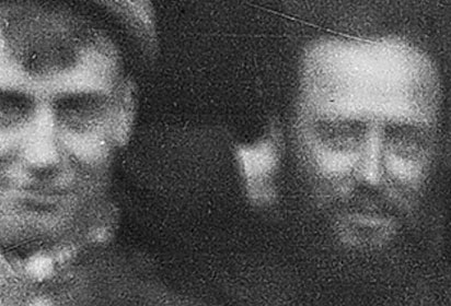 Detail of a period photo showing the faces of Ozias Leduc and a friend.