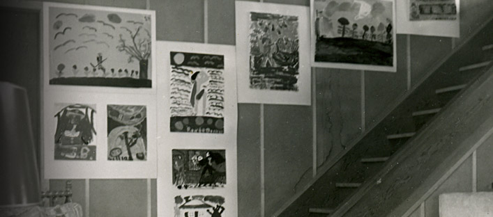 Close-up of the interior of Borduas' house, with walls covered in children's art.